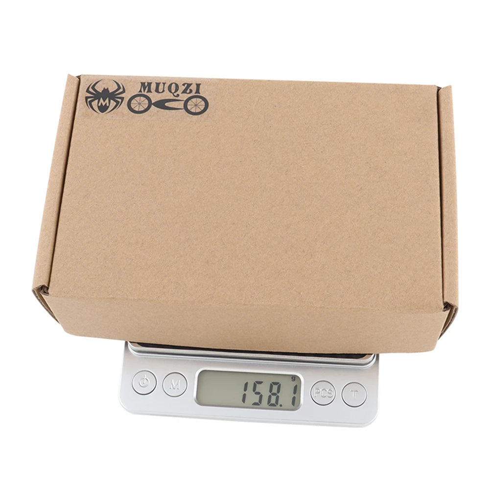 Cardboard box on a digital scale with 'MUQZI' branding.