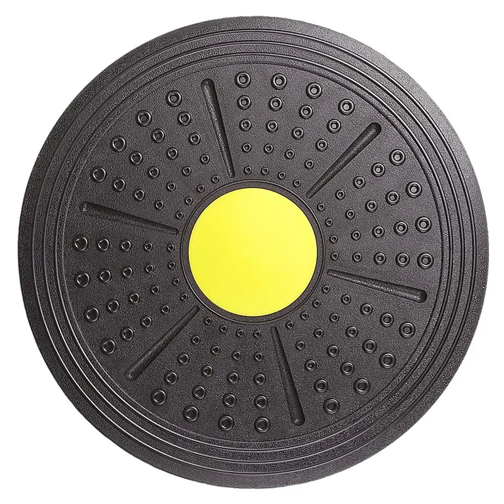 Black exercise disc with a yellow center on a white background