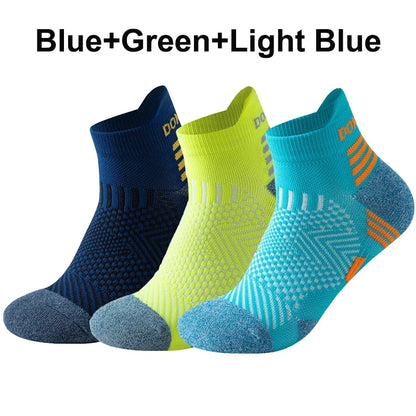 Three pairs of running socks in blue, green, and light blue on a white background