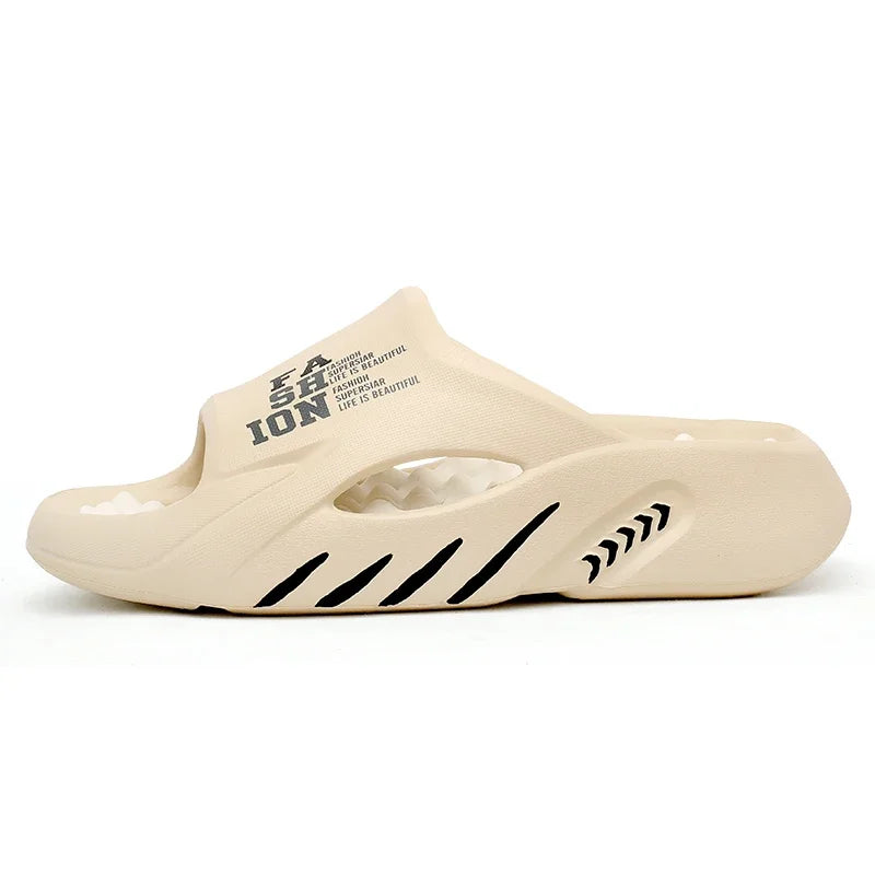 Beige slide sandal with black text and design on a white background