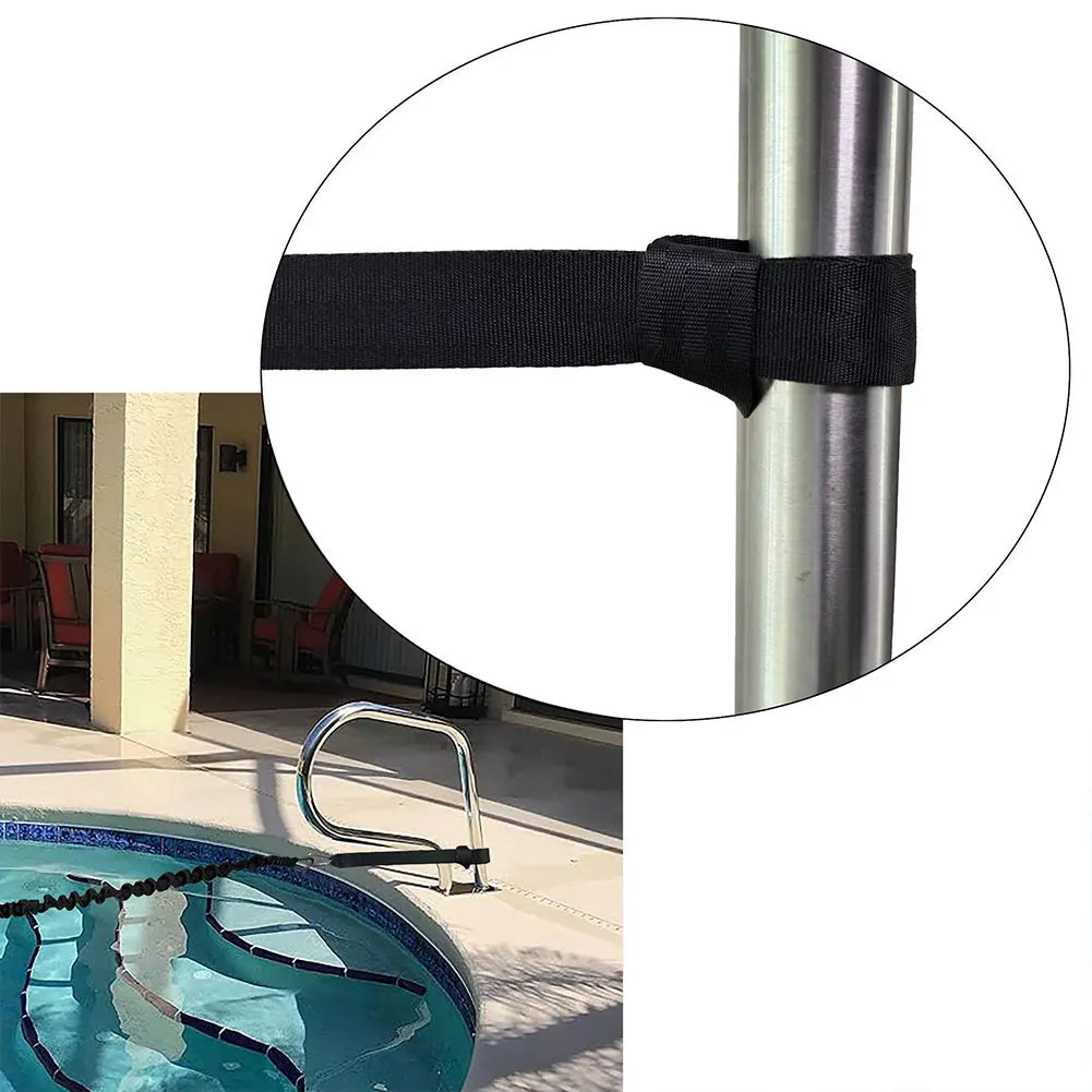 Black strap attached to a pool ladder handle with a pool and patio in the background