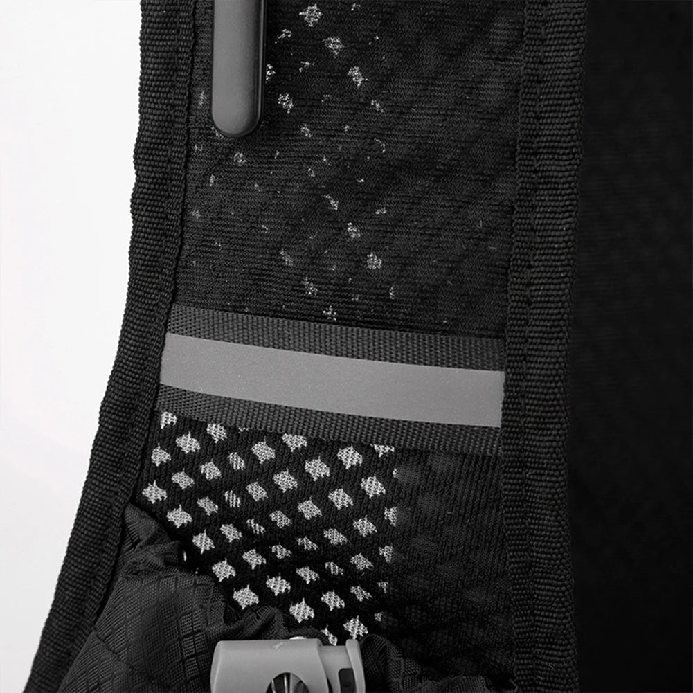 Close-up of a black backpack with reflective materials on a white background
