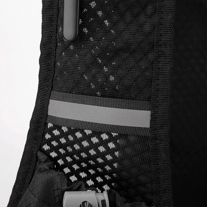 Close-up of a black backpack with reflective materials on a white background