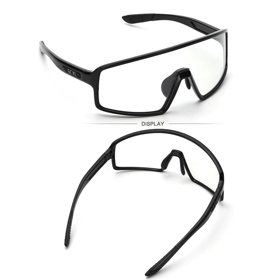 Black safety glasses with clear lenses on a white background