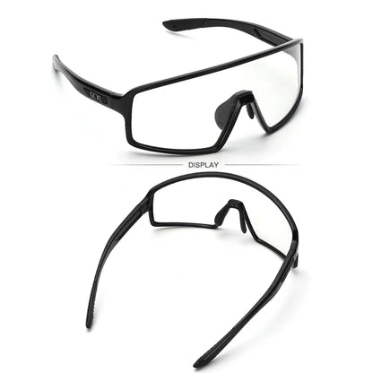 Black safety glasses with clear lenses on a white background