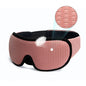 Pink sleep mask with black straps on a white background