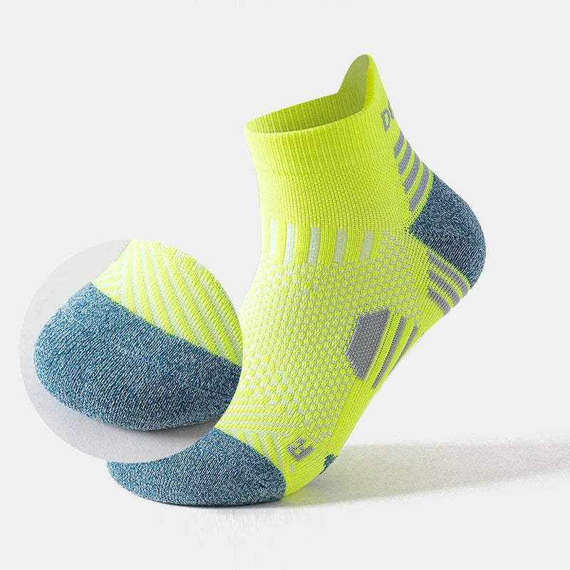 Pair of neon green and blue running  socks on a white background