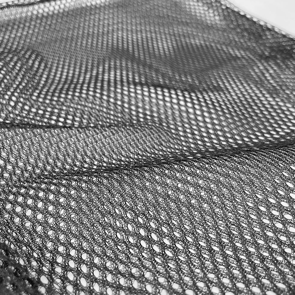 Close-up of black mesh fabric with a textured pattern