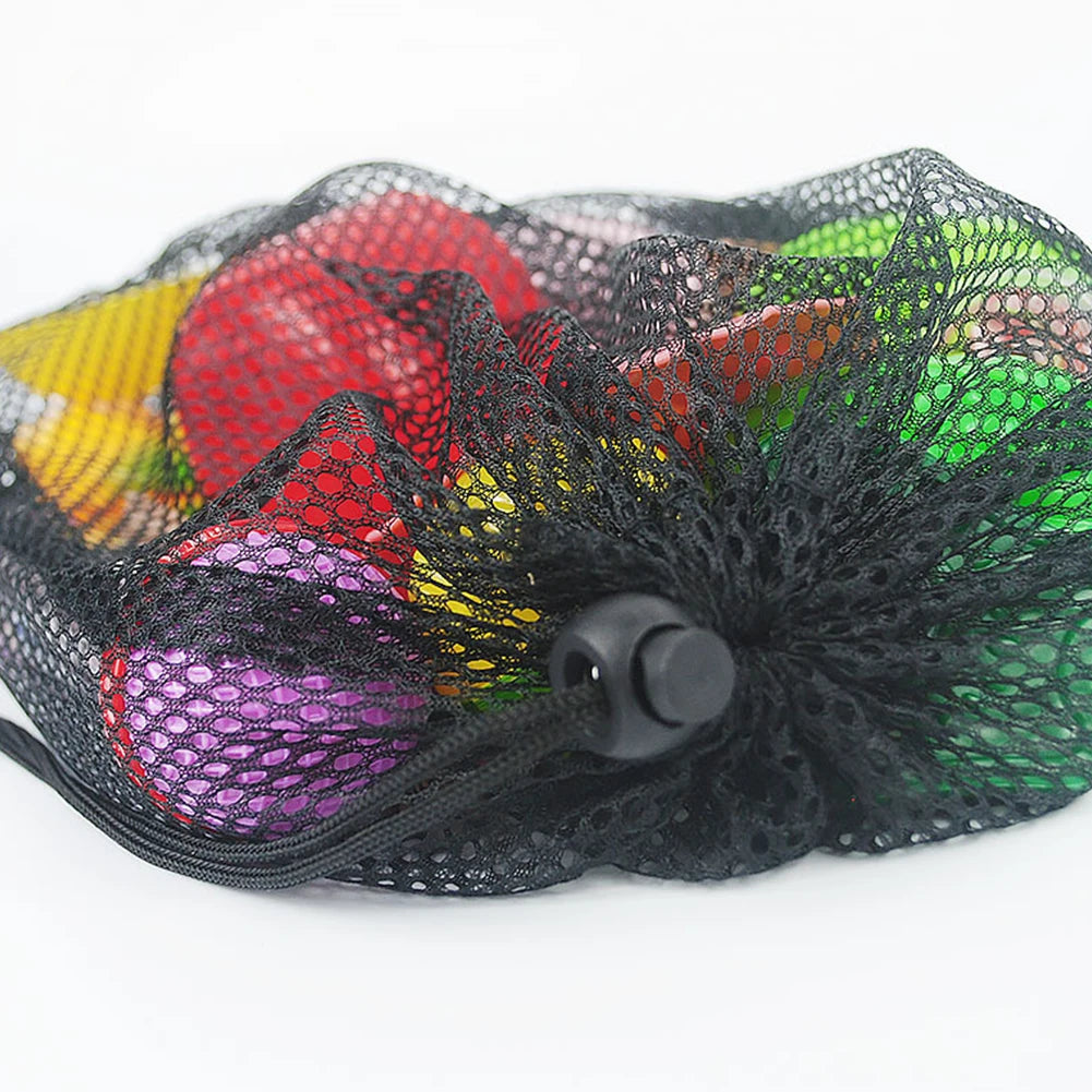 Black mesh produce bag with colorful fruits and vegetables on a white background