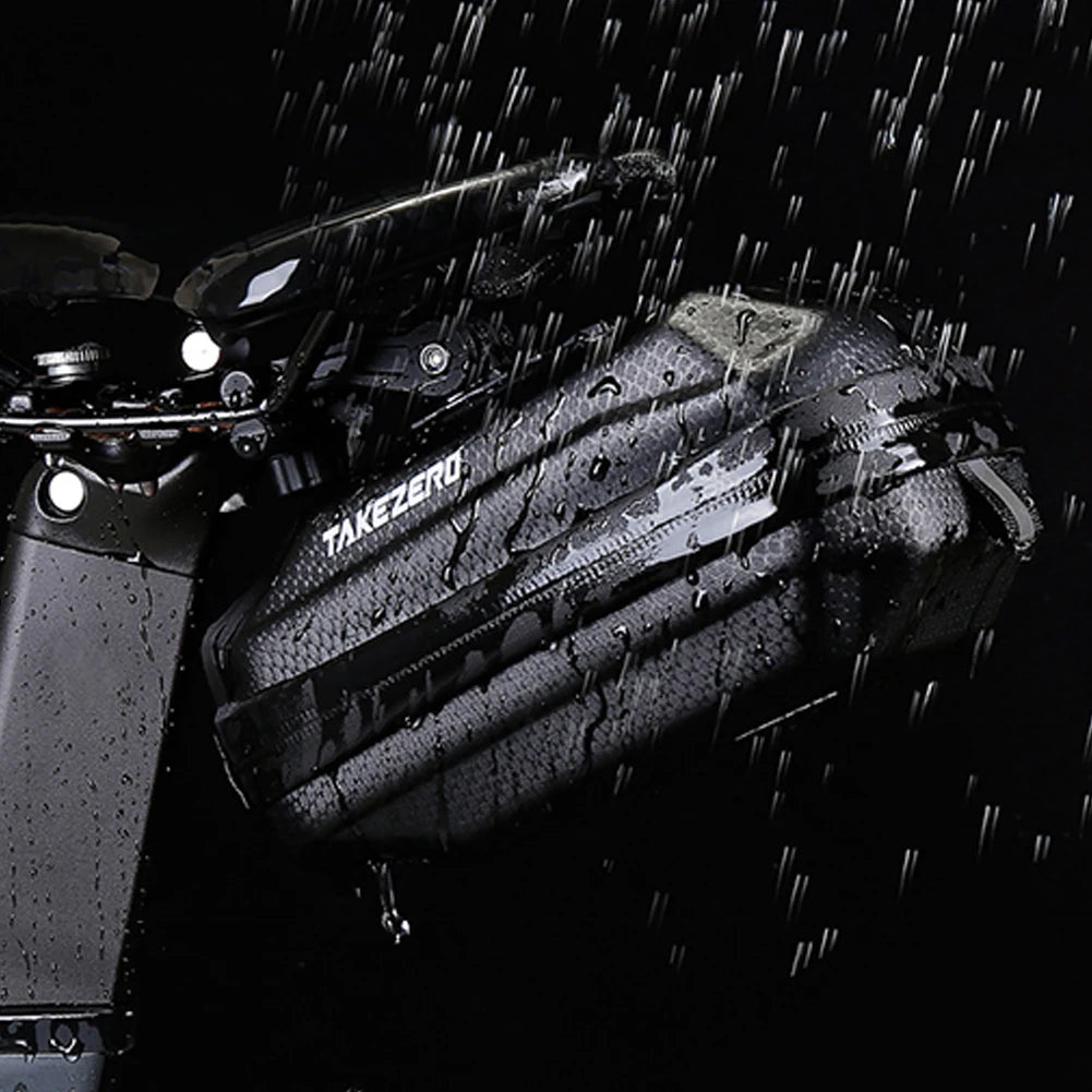 Bicycle with a black saddlebag labeled 'Takeuchi' in the rain.