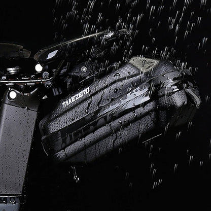 Bicycle with a black saddlebag labeled 'Takeuchi' in the rain.