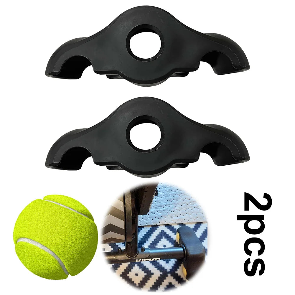 Two black plastic clips with a tennis ball and a close-up of a strap with a logo on a white background.