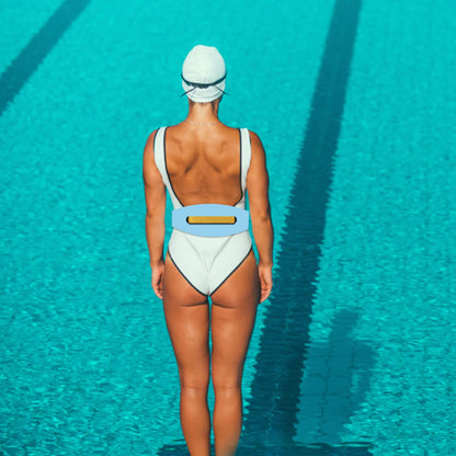 Person wearing a water belt and swim cap standing in a pool