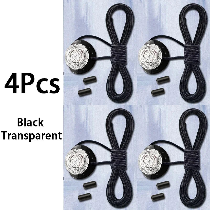 Set of four black triathlon laces with decorative ends on a light blue background.