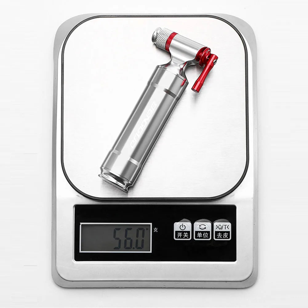 CO2 trigger with red cap on a digital kitchen scale displaying weight