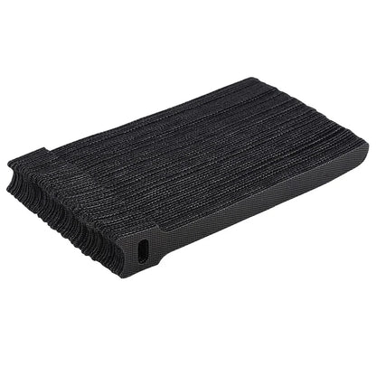 Black cable ties with textured surface on a white background