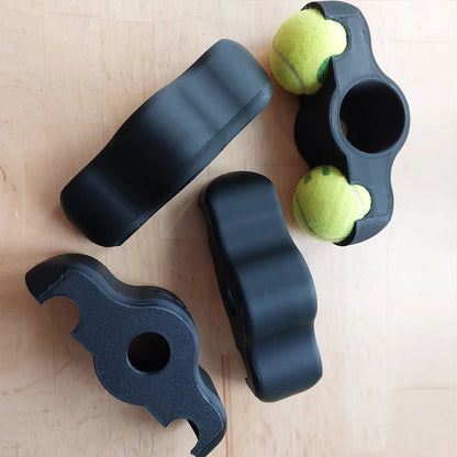 Vibration dampers with tennis balls on a wooden surface