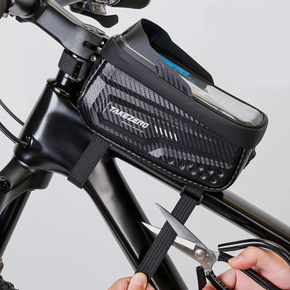 Bicycle frame bag with a phone inside, being cut open by scissors.