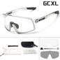 Clear safety glasses with black accents and GCXL branding, including additional lenses and case on a white background.