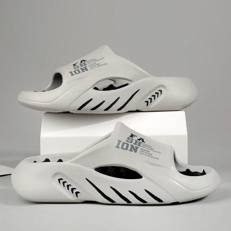 White sandals with black accents and 'Fashion' text on a gray background
