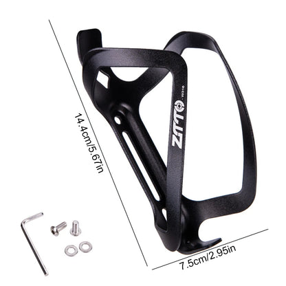 Black bicycle bottle cage with mounting hardware on a white background
