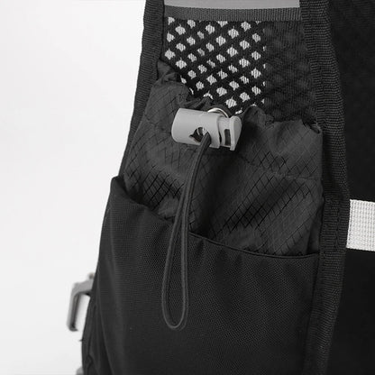 Close-up of a black backpack with a patterned pouch inside on a white background