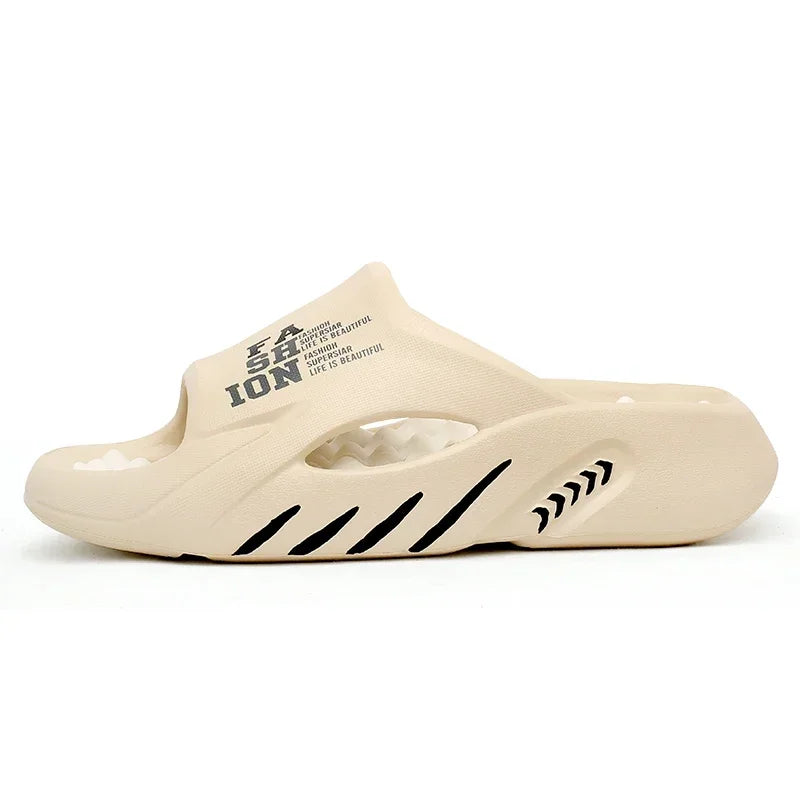 Beige slide sandal with black text and design on a white background