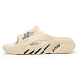 Beige slide sandal with black text and design on a white background