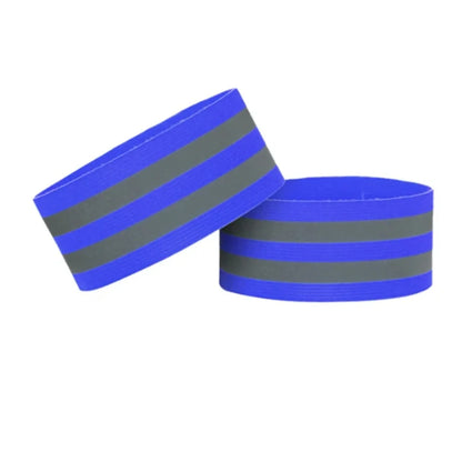 Two blue wristbands with reflective gray stripes on a white background