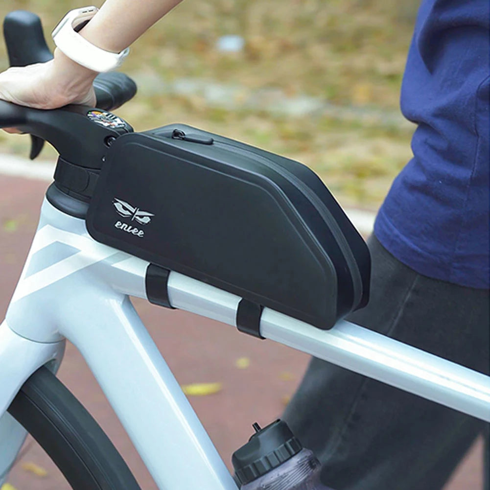 Black bike bag attached to a bicycle with a blurred background