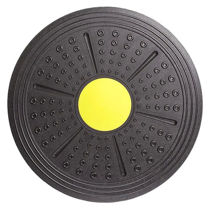 Black exercise disc with a yellow center on a white background