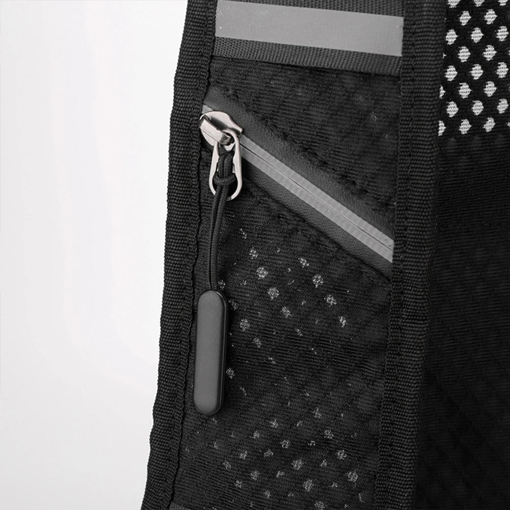 Close-up of a black backpack with reflective stripes on a white background