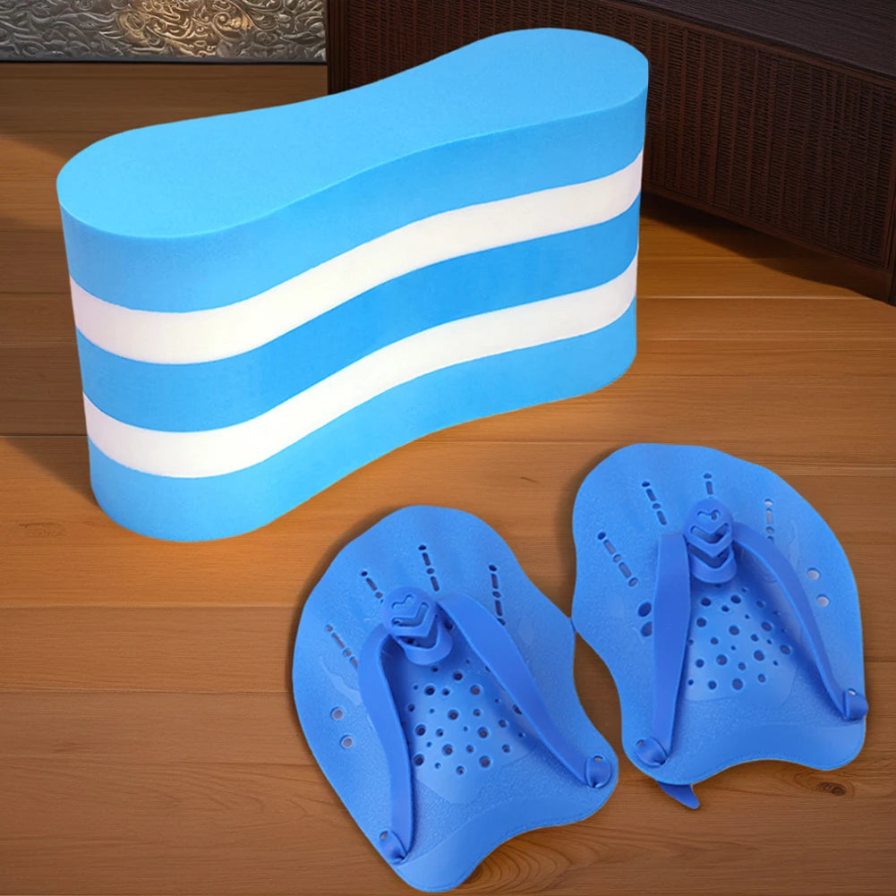 Blue swim float and hand paddles on a wooden surface