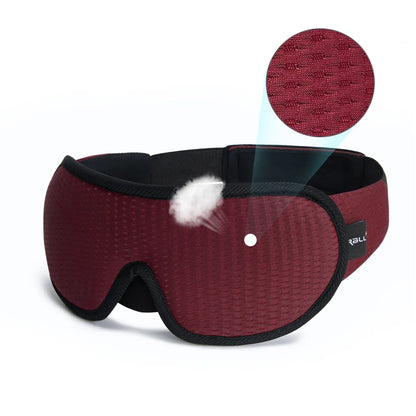 Red sleep mask with black trim on a white background, showing texture detail.