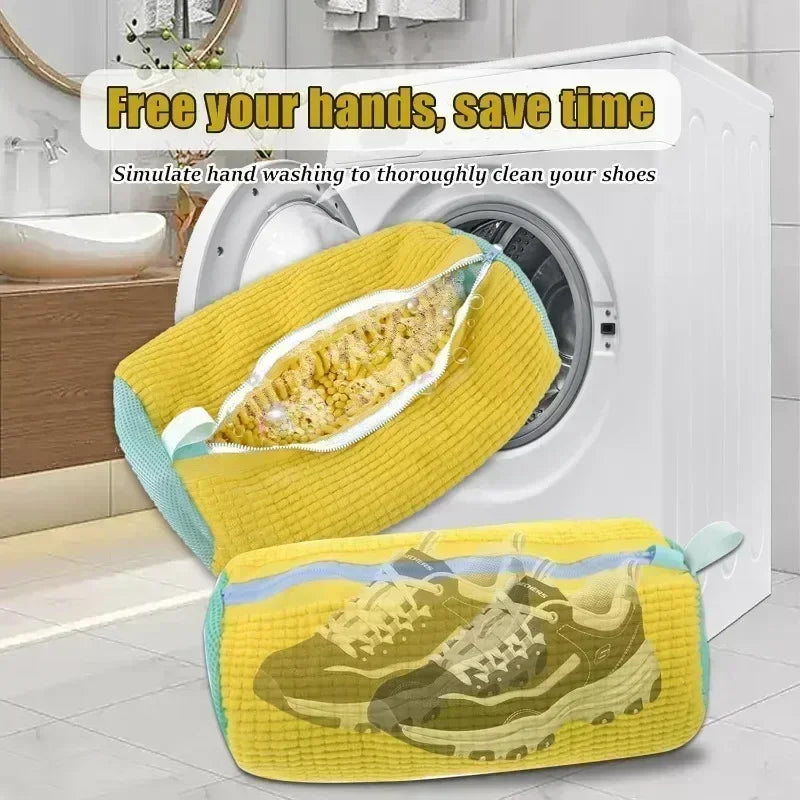 Yellow shoe cleaning bag with transparent cover simulating hand washing, placed in front of a washing machine.