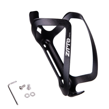 Black bicycle bottle cage with mounting hardware on a white background