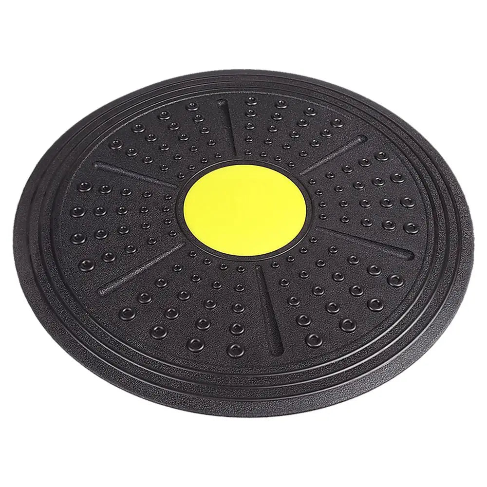 Black exercise disc with a yellow center on a white background