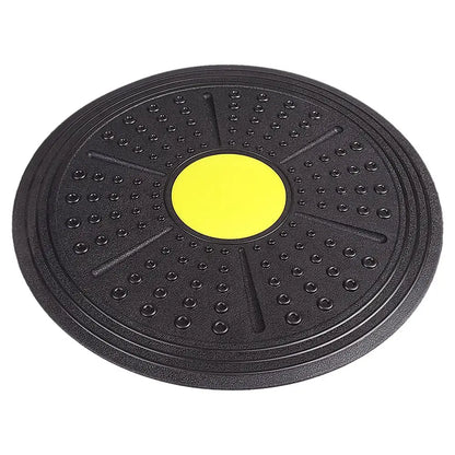 Black exercise disc with a yellow center on a white background