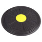Black exercise disc with a yellow center on a white background