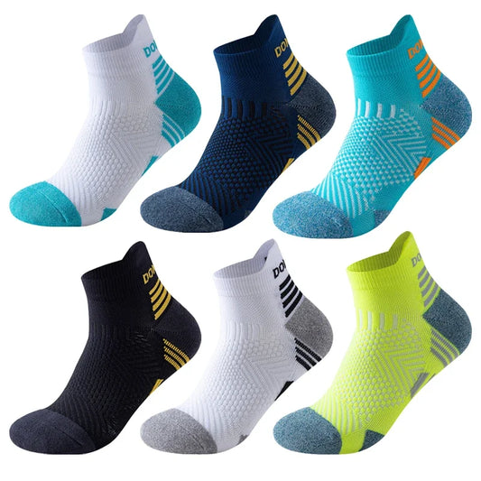 Set of six pairs of running socks in various colors on a white background