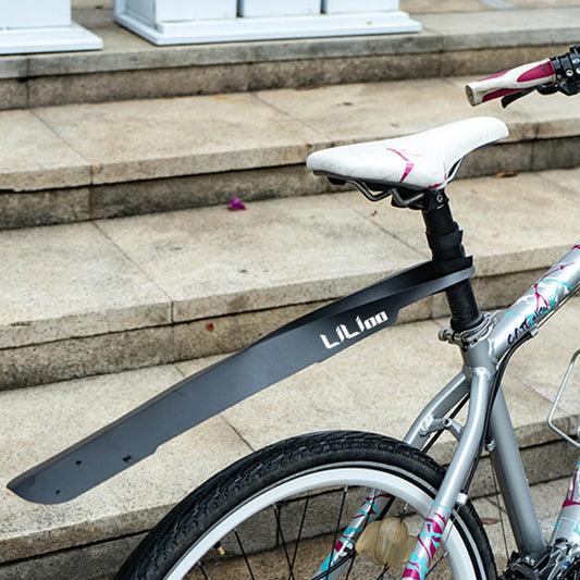 Bicycle with a black mudguard on a stone staircase