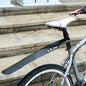 Bicycle with a black mudguard on a stone staircase