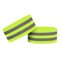 Two neon green wristbands with reflective gray stripes on a white background