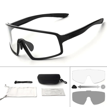 Black safety glasses with additional lenses and case on a white background