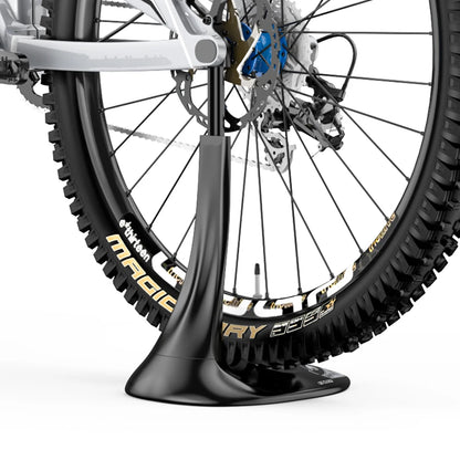 Bicycle wheel on a stand with 'Magic Dry' branding on a white background